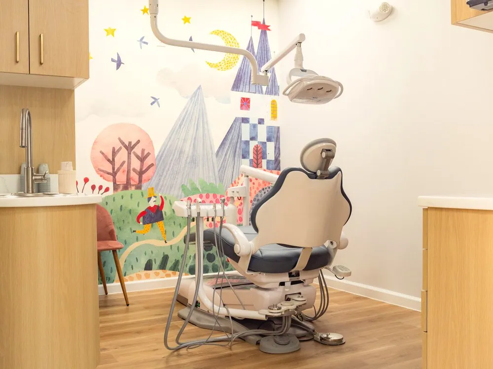 Castle-mural treatment room with a kid-sized dental chair